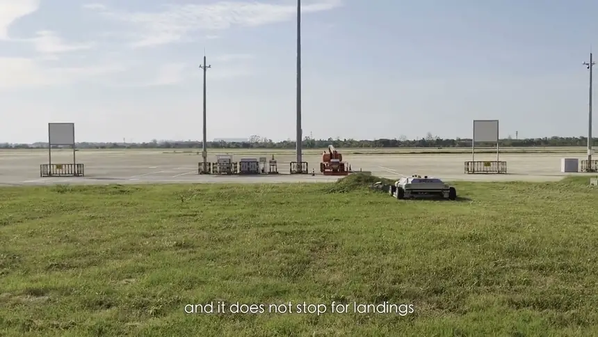 A60i mowing beside an airport apron