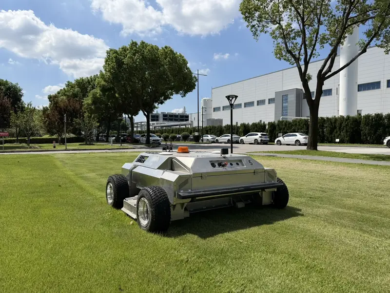 Amotrol A60i parked on a corporate campus lawn after a mowing demo