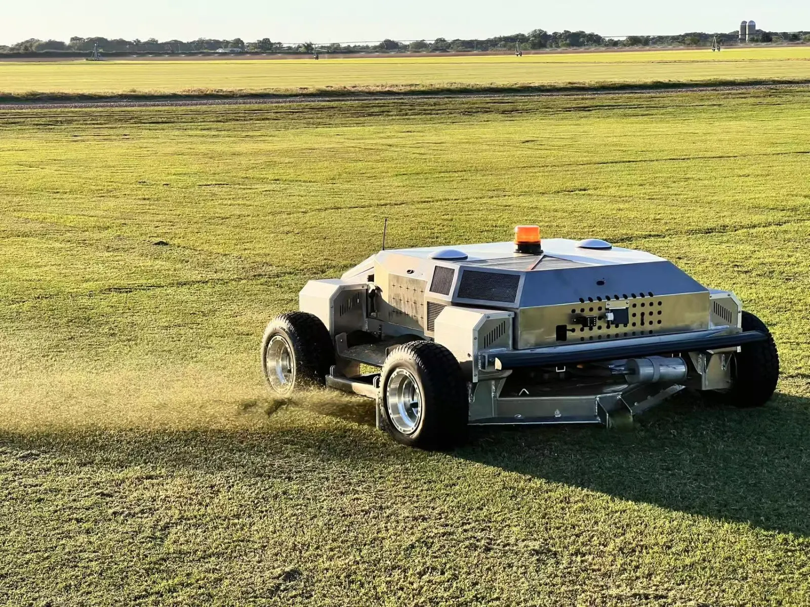 Amotrol A60i commercial robotic mower cutting turf with clippings discharging